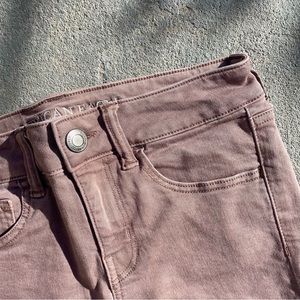 American Eagle mauve colored midi shorts.